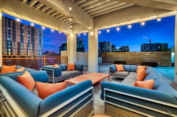 a terrace with couches and a coffee table